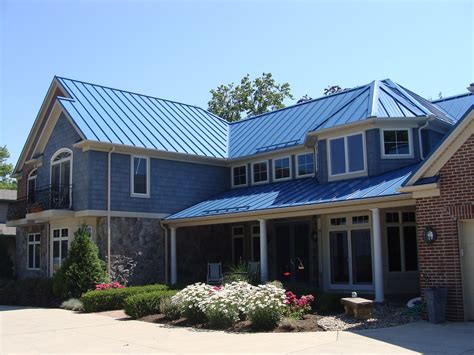 blue houses with metal roofs|gray house with blue roof.